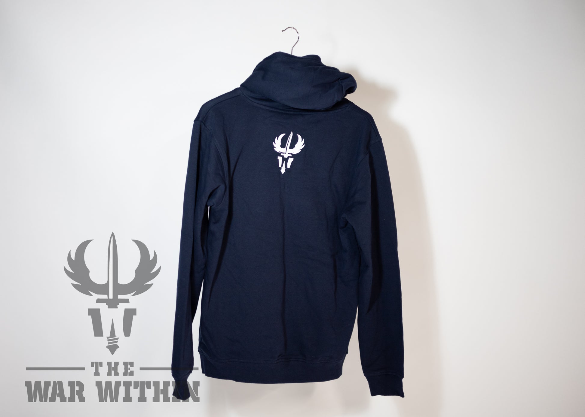We all have heavy days, sometimes it is a question to remember that we are not alone on this planet. Jon A. Archambault Author of Operation: Wired Differently and mental health advocate, has put together a curated apparel line to help him on his journey.  Hooded sweater, Navy Blue.